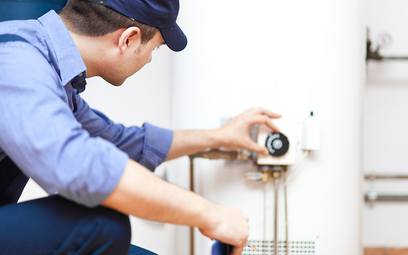 Plumber fixing a Water Heater